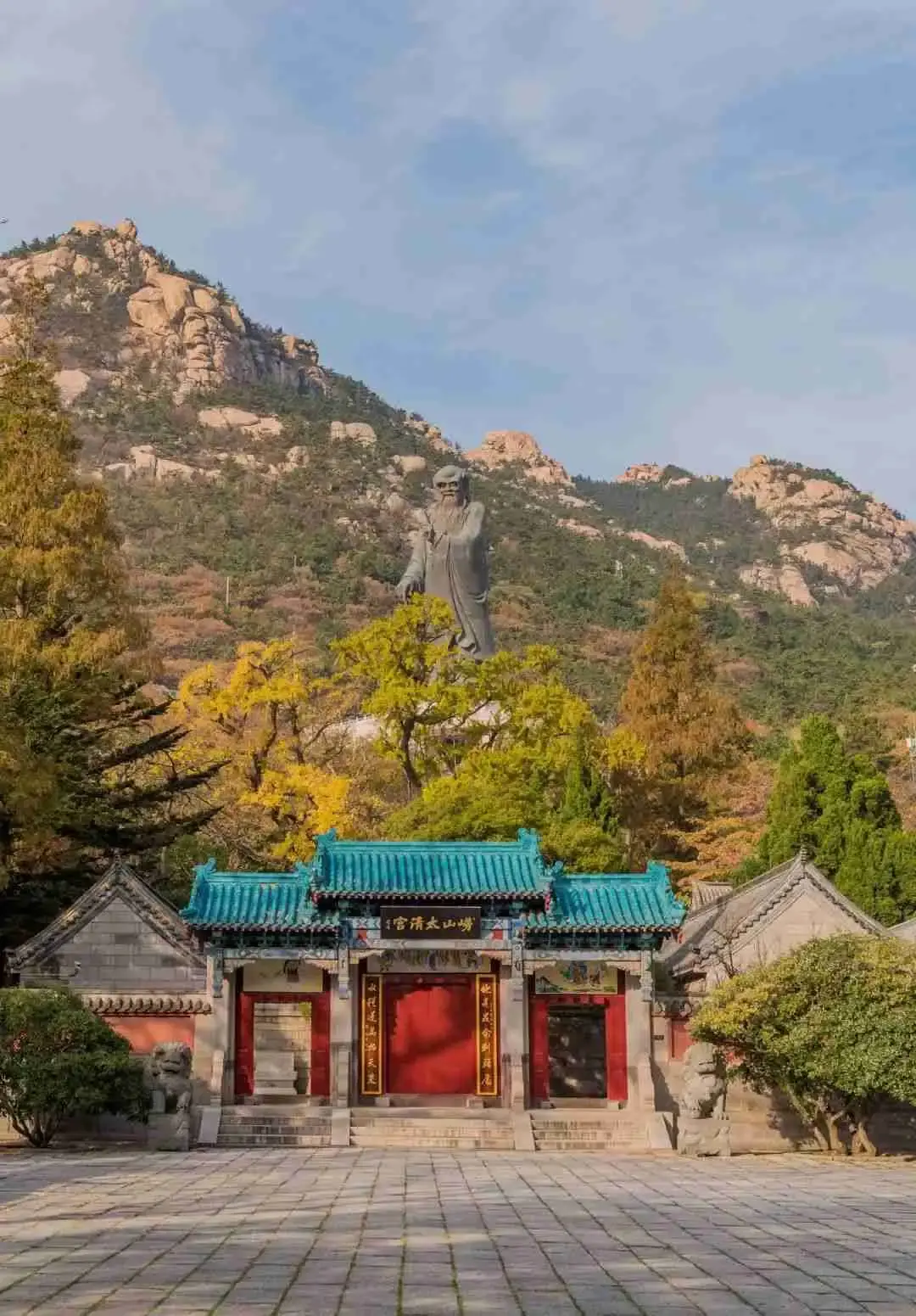 The Laozi statue towering above the teal roofs of Taiqing Palace
